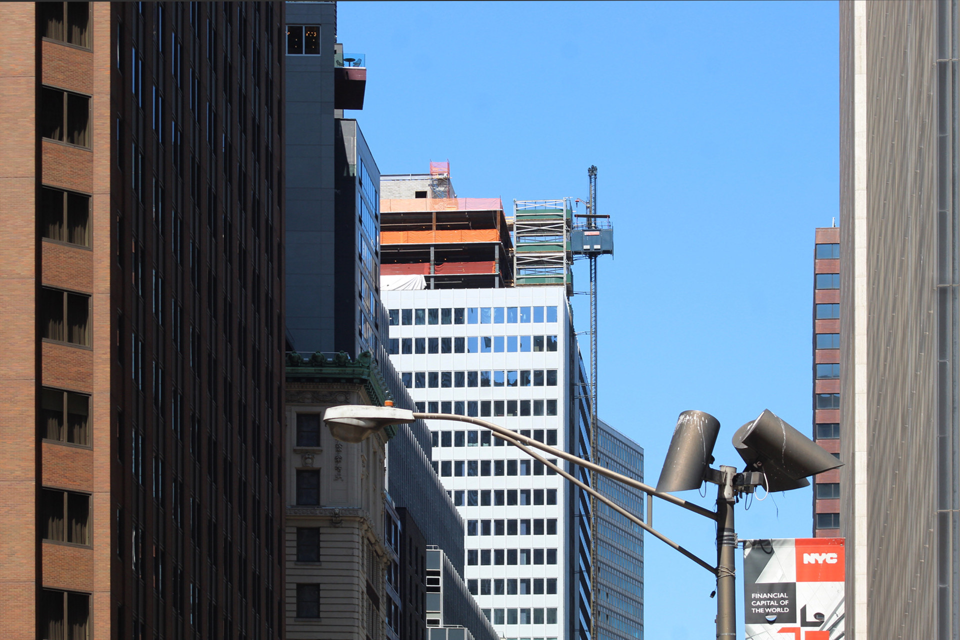 Street-level perspective of 160 Water Street, a residential conversion project in New York City's Financial District.
