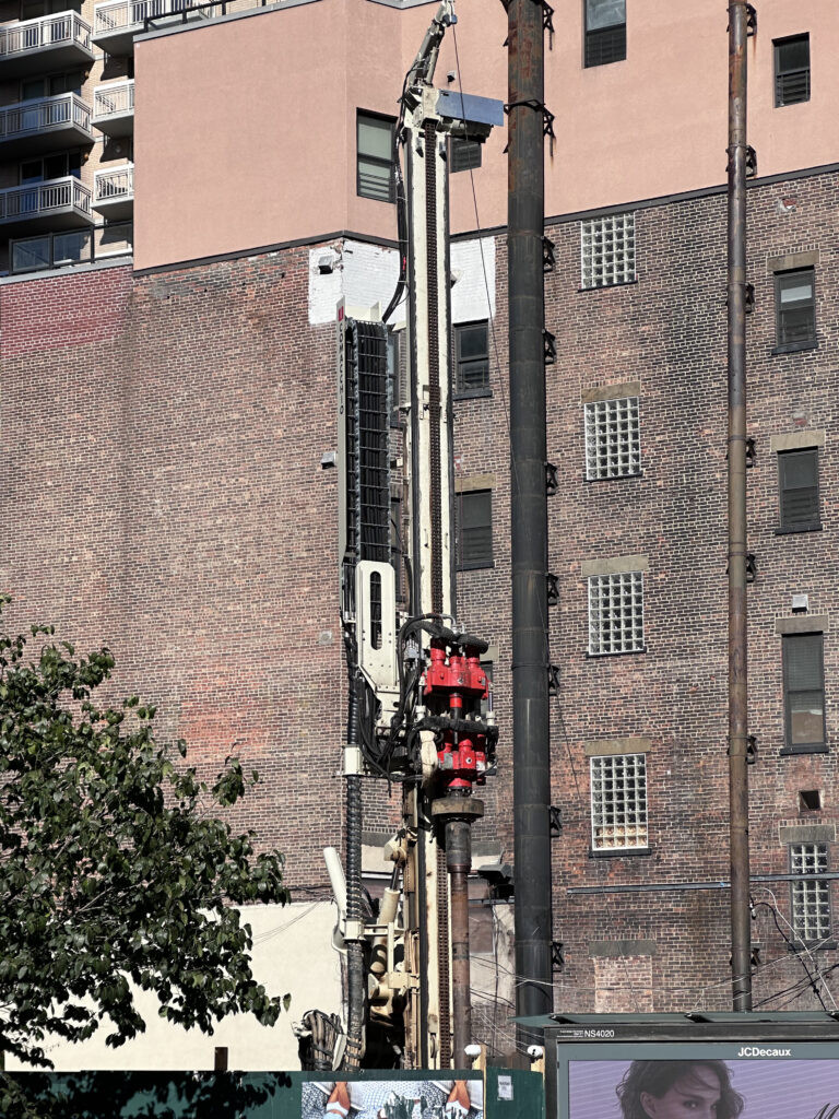 Construction equipment including piling machine at East 86th Street development site