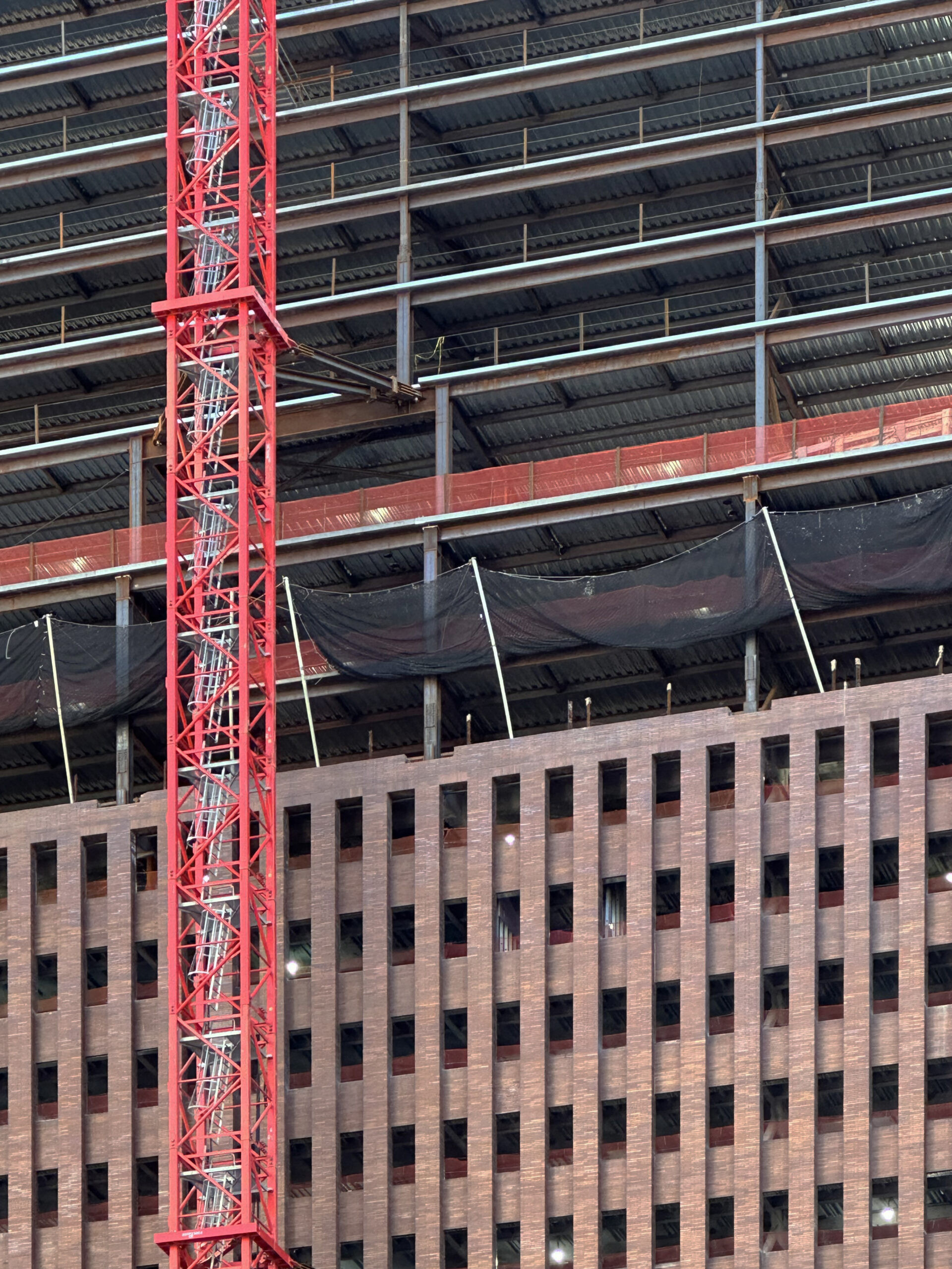 Angle shot of 25 Water Street, highlighting the addition of new floors to the original office building structure.