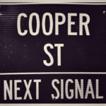Exterior view of Cooper Street Antique Mall in Arlington, Texas, showcasing its large size and entrance.