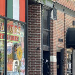 Taylor Street in Chicago's Little Italy, showcasing historic buildings and vibrant street life