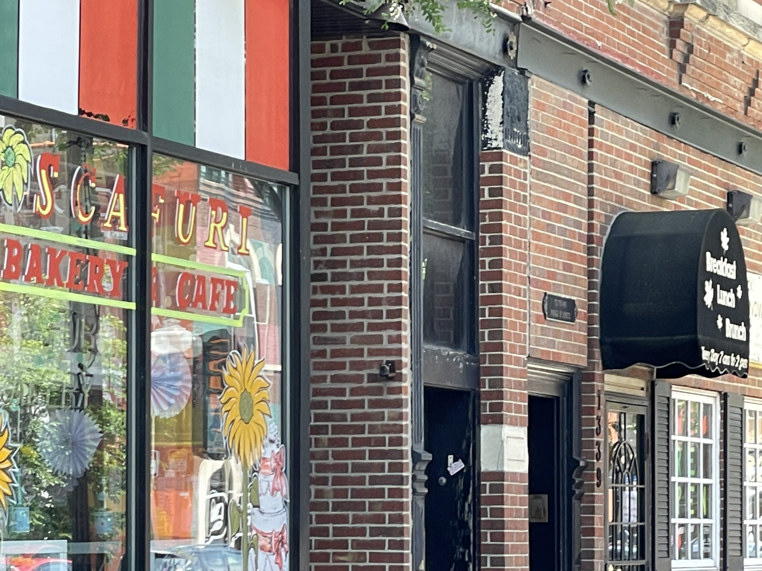 Taylor Street in Chicago's Little Italy, showcasing historic buildings and vibrant street life