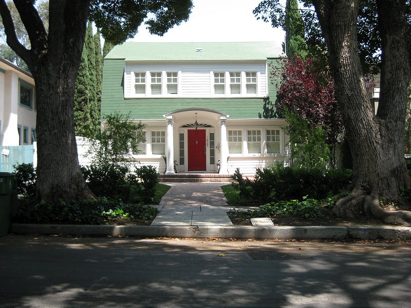 Blaze excitedly taking a picture in front of the Nightmare on Elm Street house, overwhelmed with excitement.