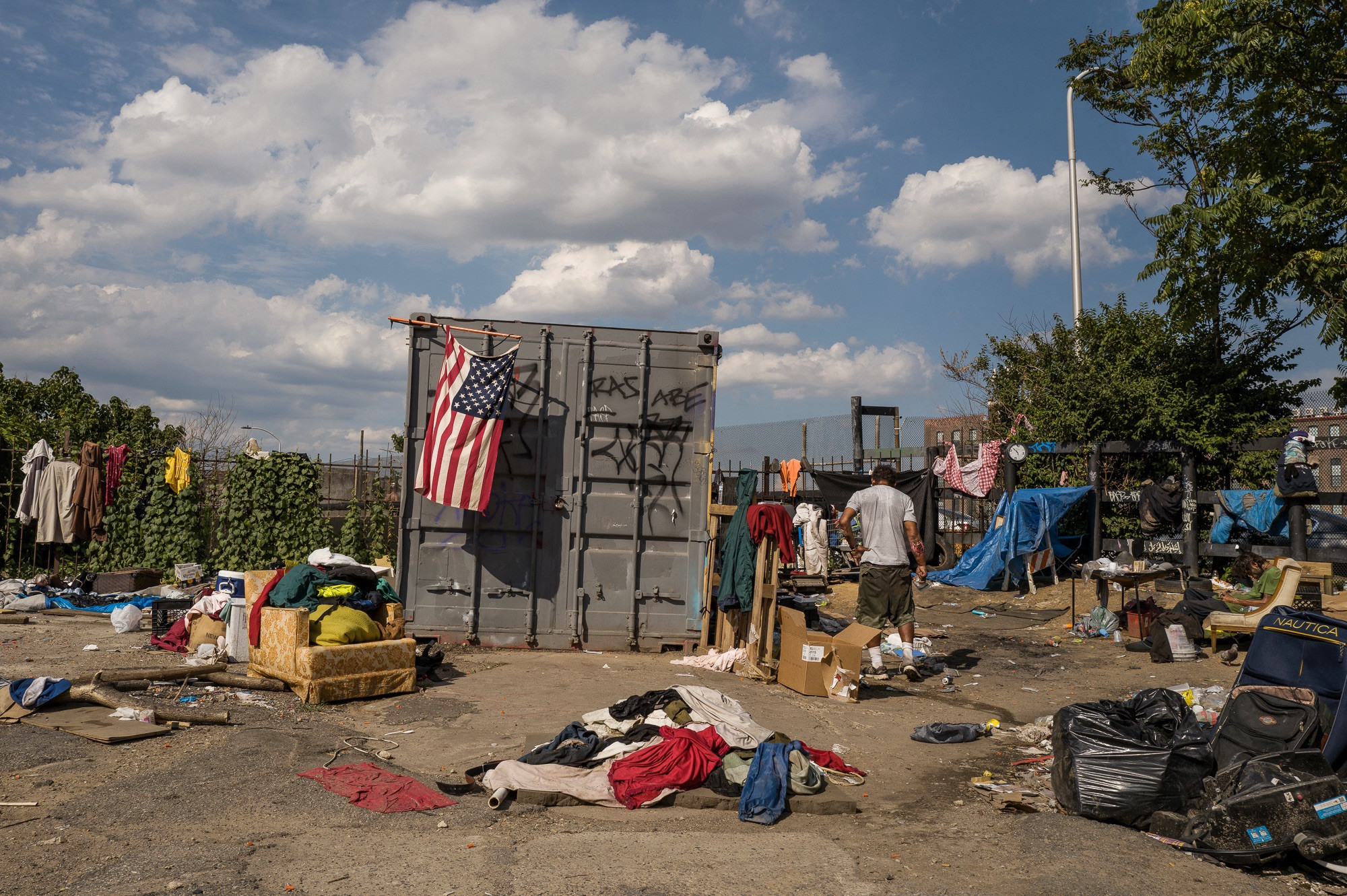 An American flag on East Gurney Street in Kensington, Philadelphia, telling a story of national challenges within a local context.