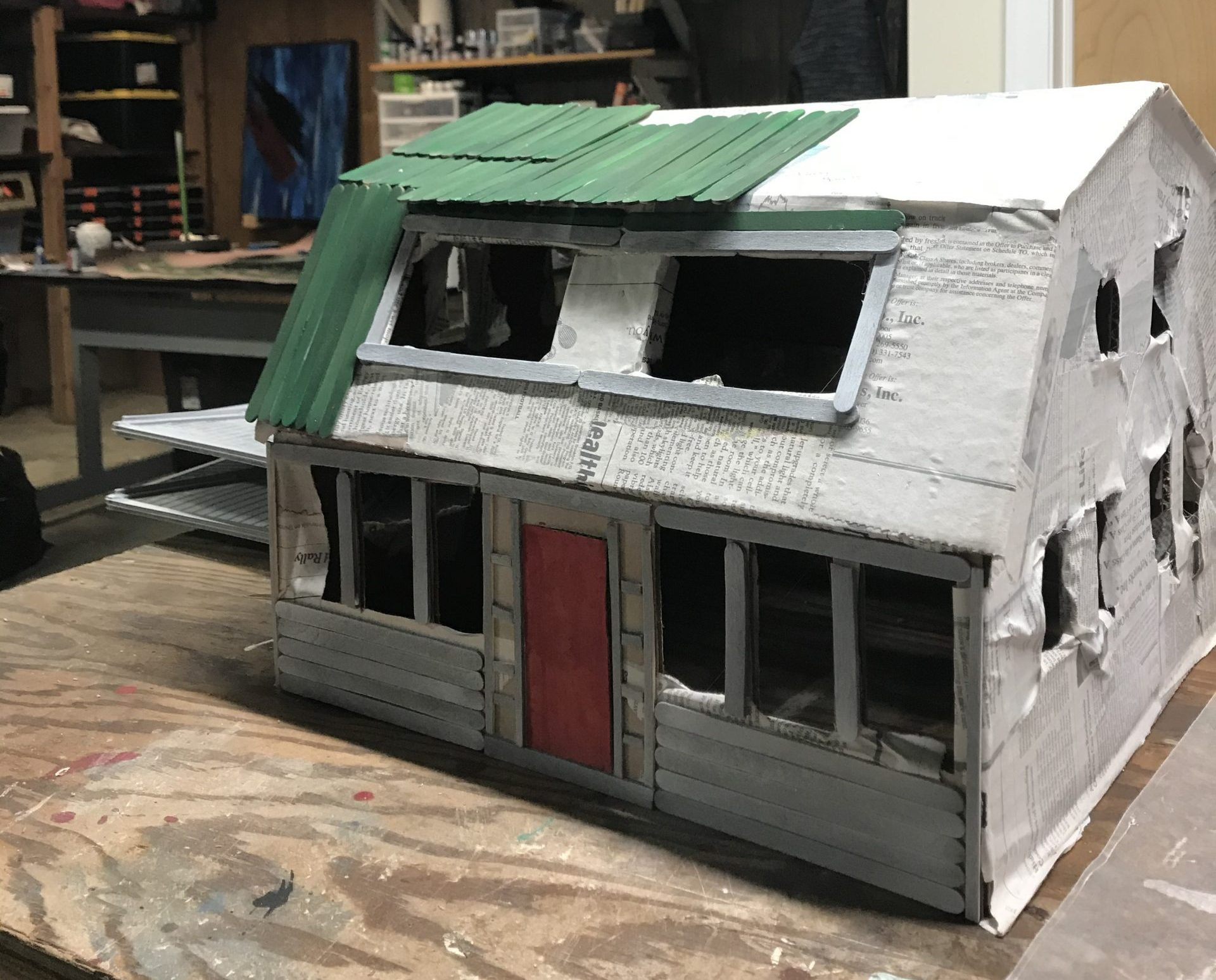 Painted popsicle stick clapboards and roof shingles for the Elm Street house model