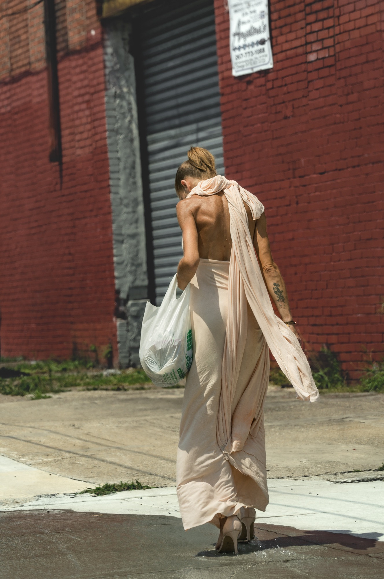 The intense heat of summer on East Lehigh Avenue in Kensington, Philadelphia, underscoring the harsh living conditions in the area.