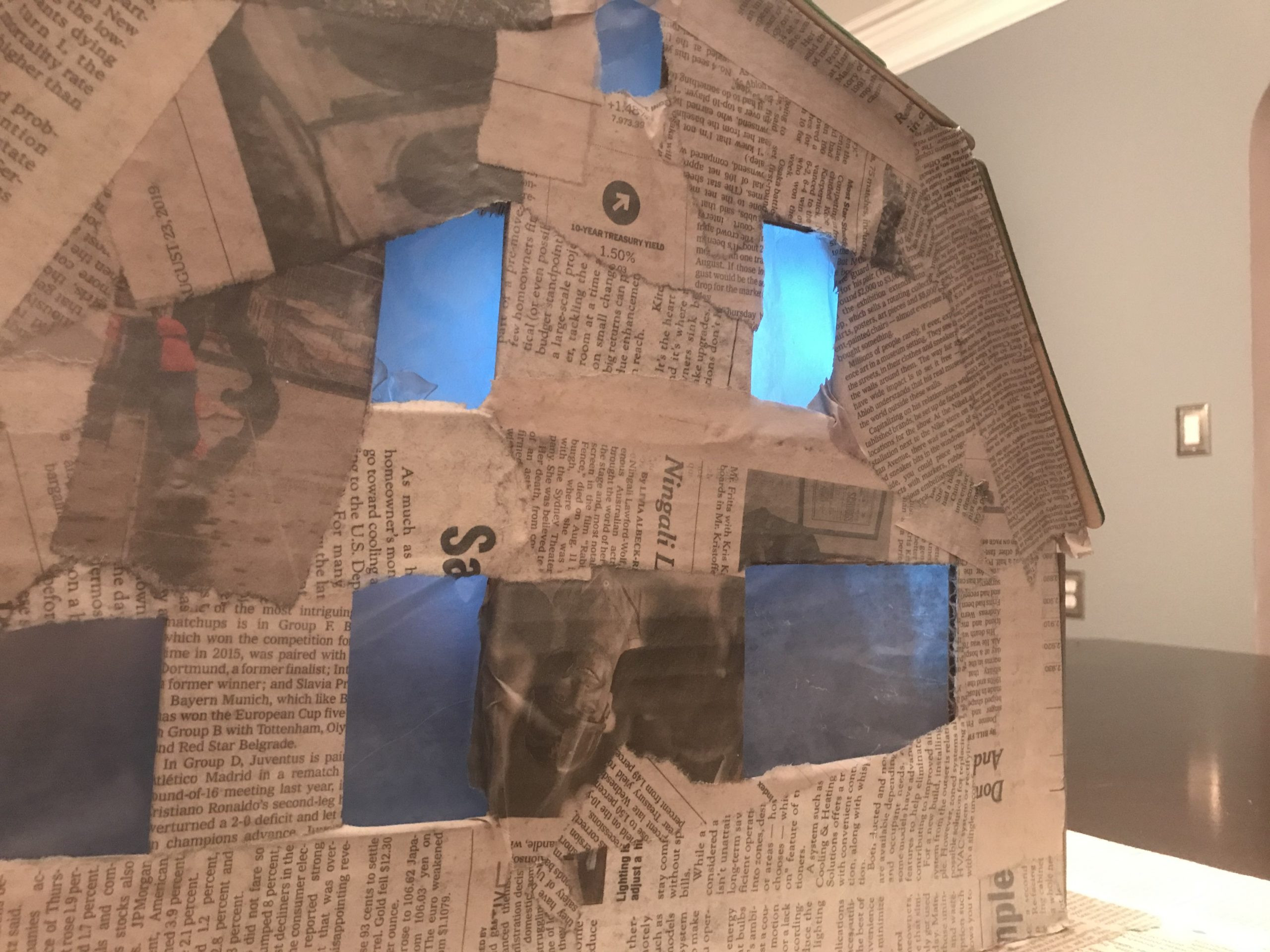 Wax paper diffuses LED light inside the paper Elm Street house model