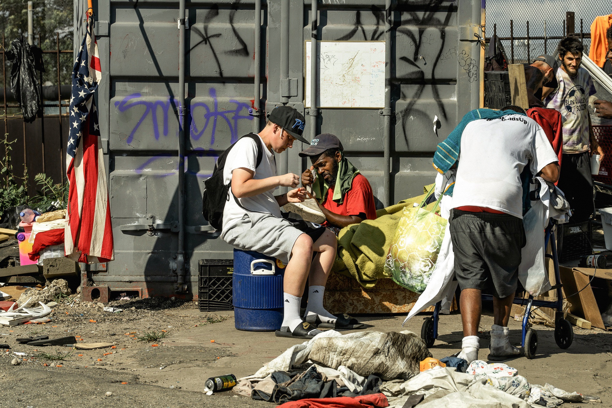Urban decay and social issues are evident on East Gurney Street in Kensington, Philadelphia, highlighting the challenges faced by the community.