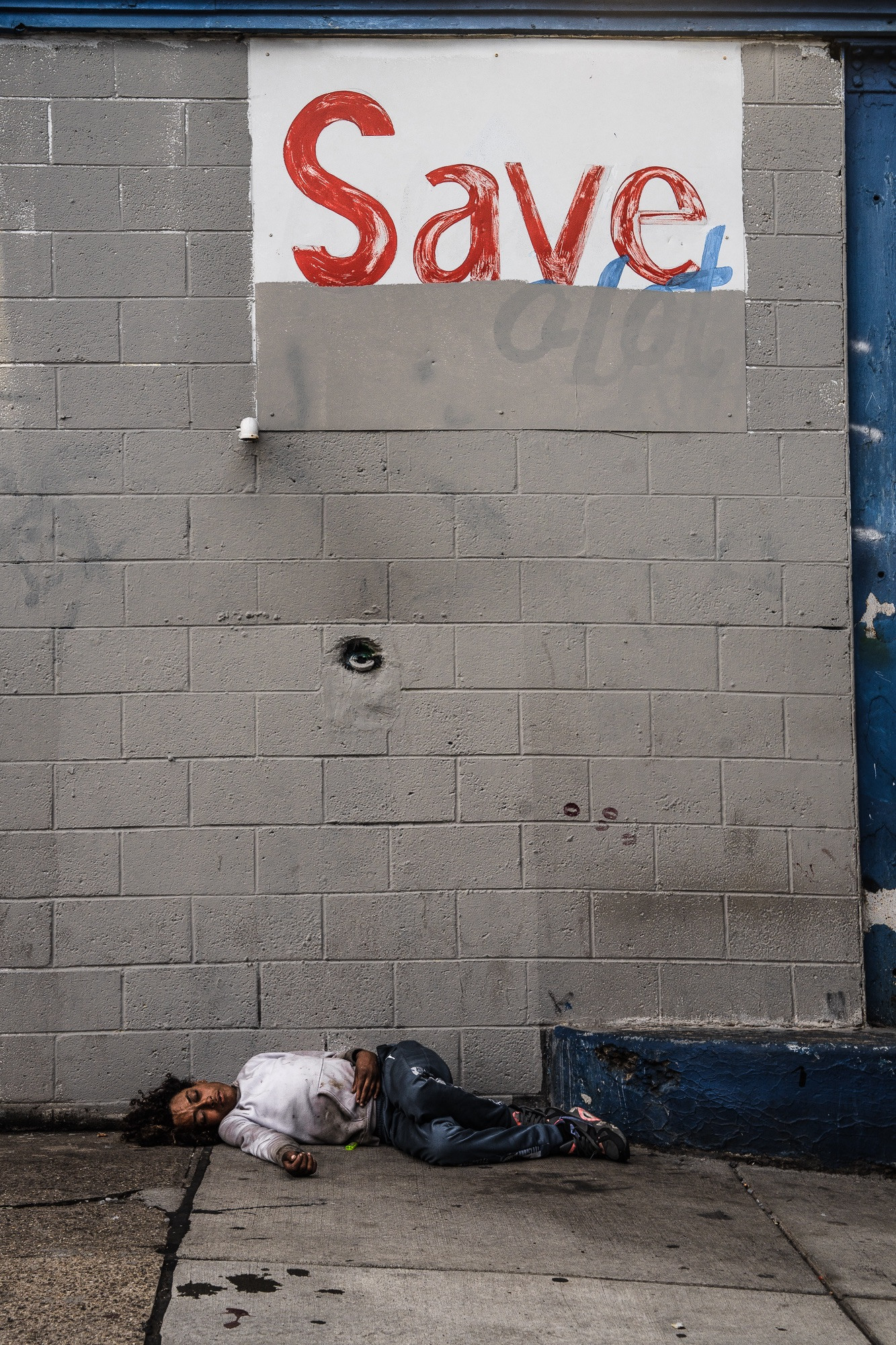 A young woman on Pacific Street in Kensington, Philadelphia, a frequent presence who suddenly disappeared, embodying the precariousness of life on the streets.