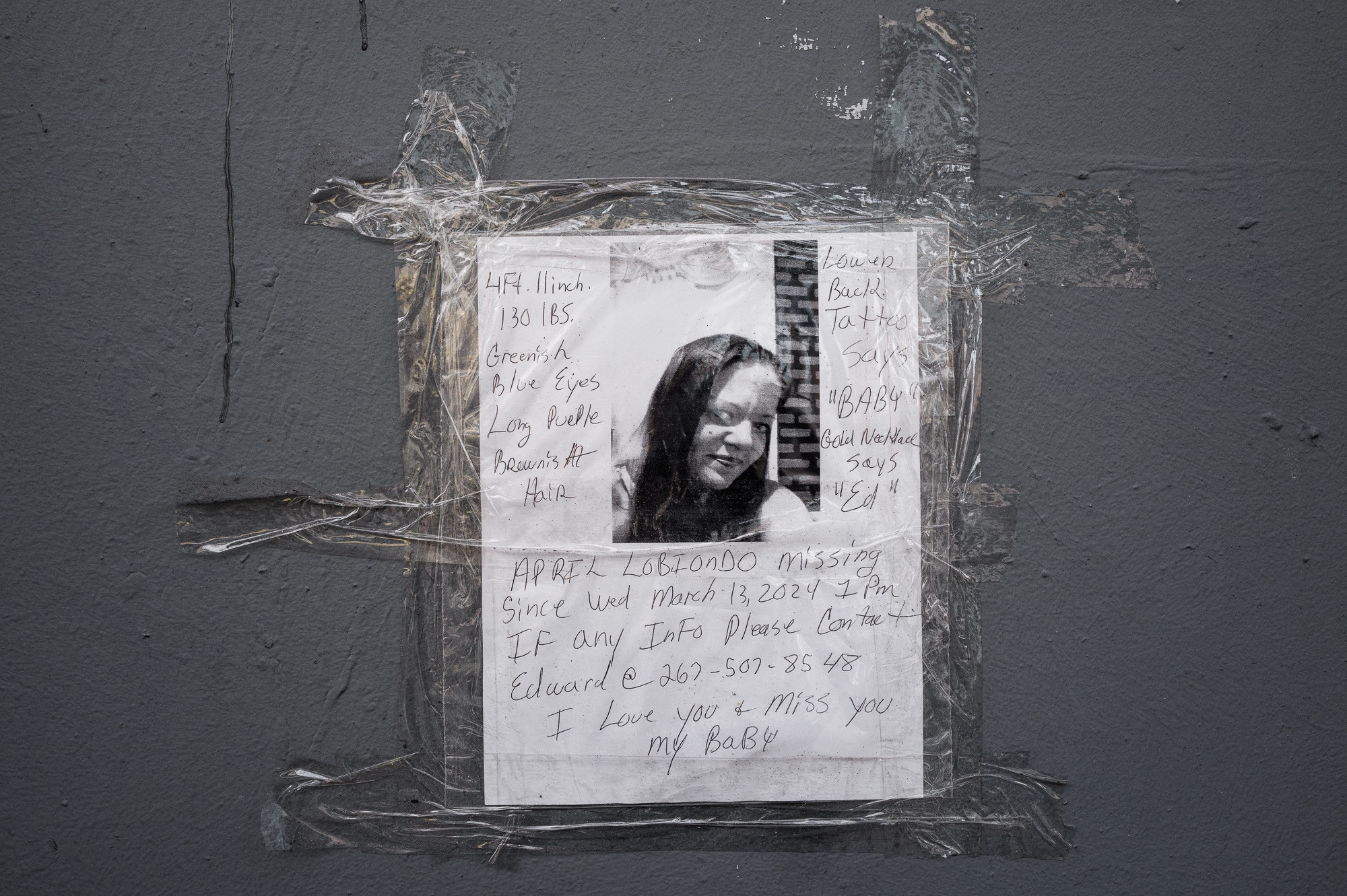 A &quot;Missing&quot; poster in Kensington, Philadelphia, symbolizing the ongoing crisis of disappearances and the fragility of life on the streets.