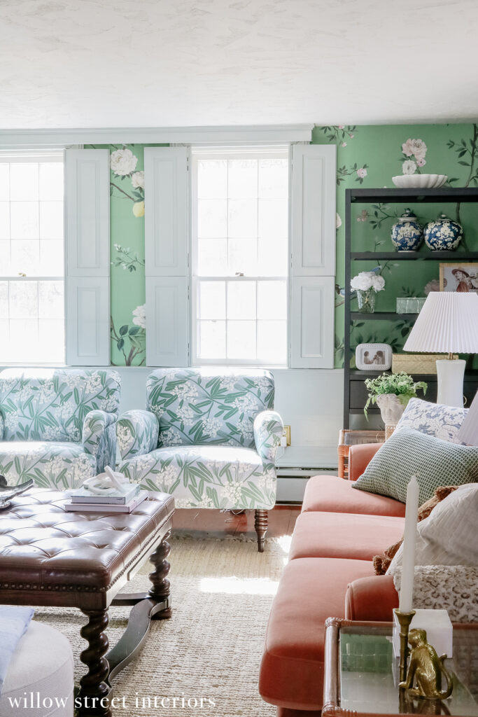 A hallway with patterned wallpaper and a framed artwork, showcasing Willow Street Interiors' design extending beyond the main living spaces into transitional areas.
