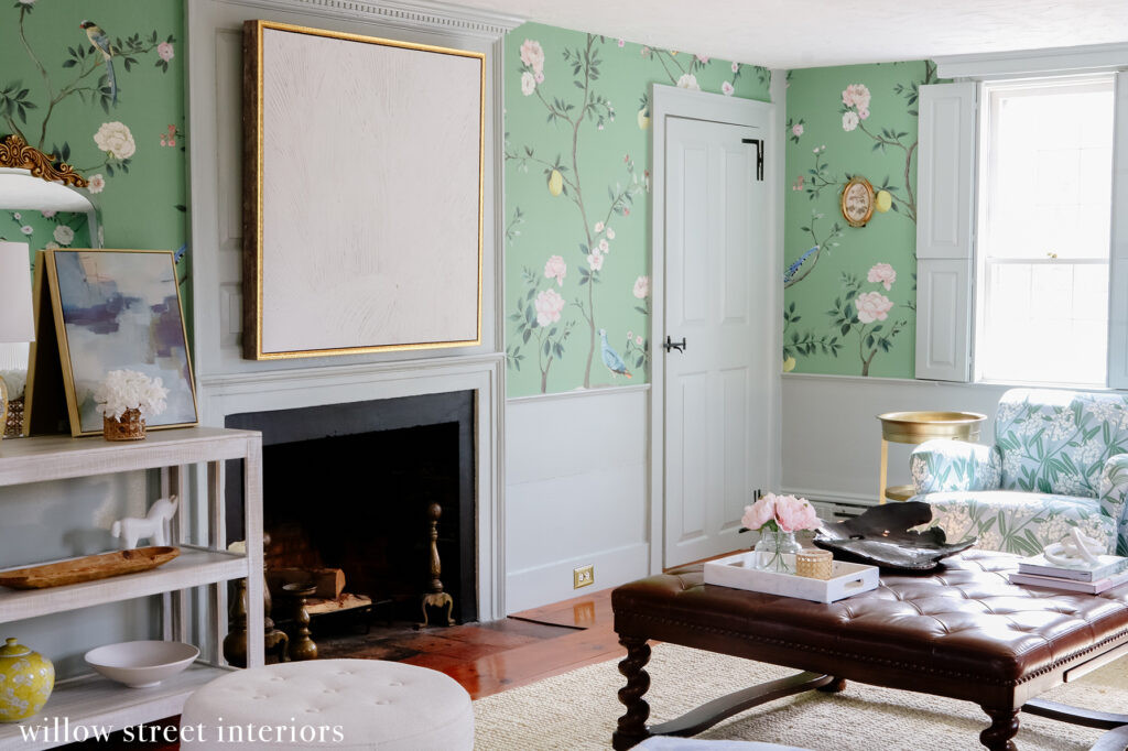 Wide shot of a living room designed by Willow Street Interiors, showing the overall layout, furniture arrangement, and the cohesive blend of colors and patterns throughout the space.
