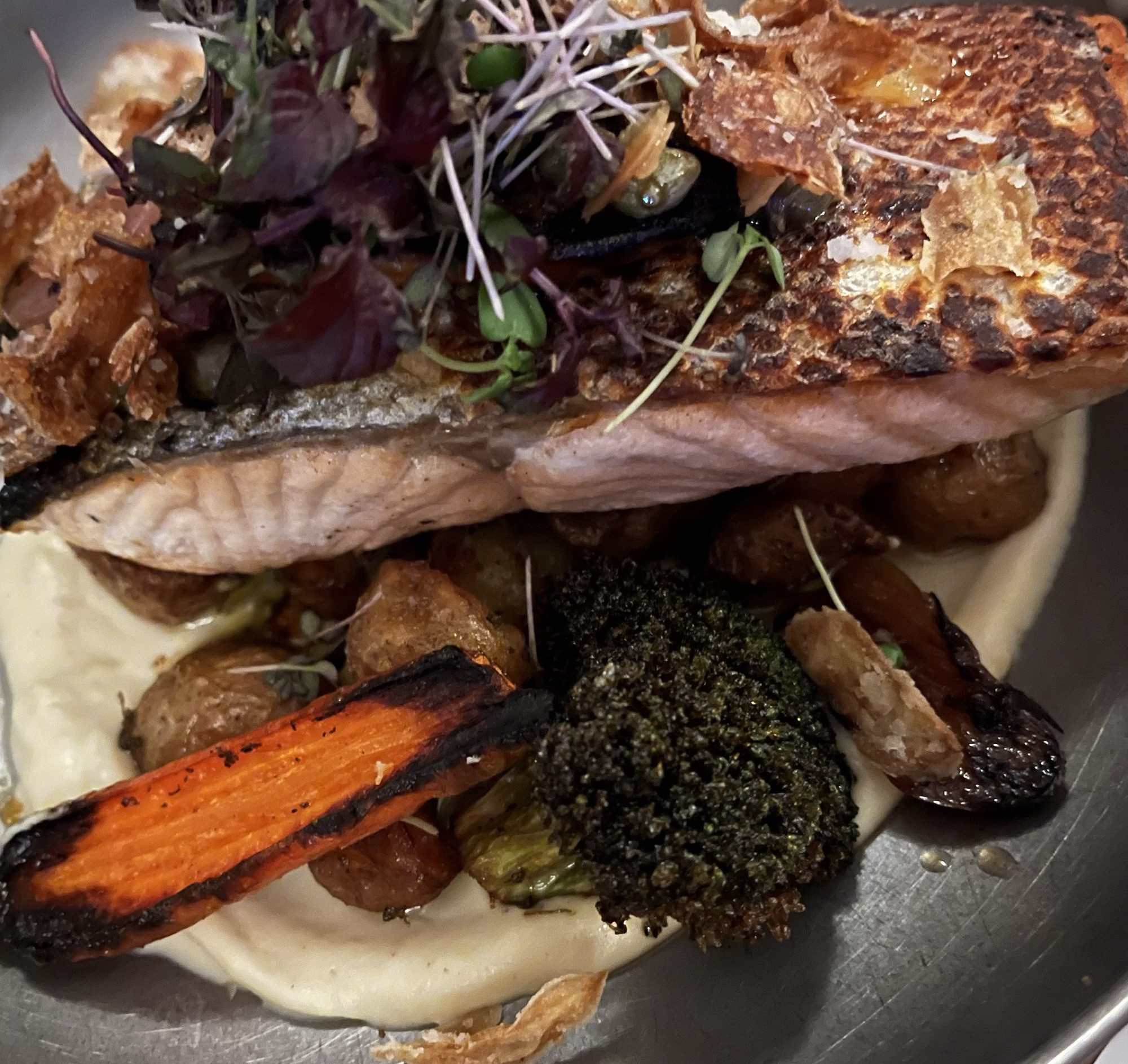 Perfectly cooked salmon dish, a healthy and delicious option at Posthus Matholl Food Hall in Reykjavik.