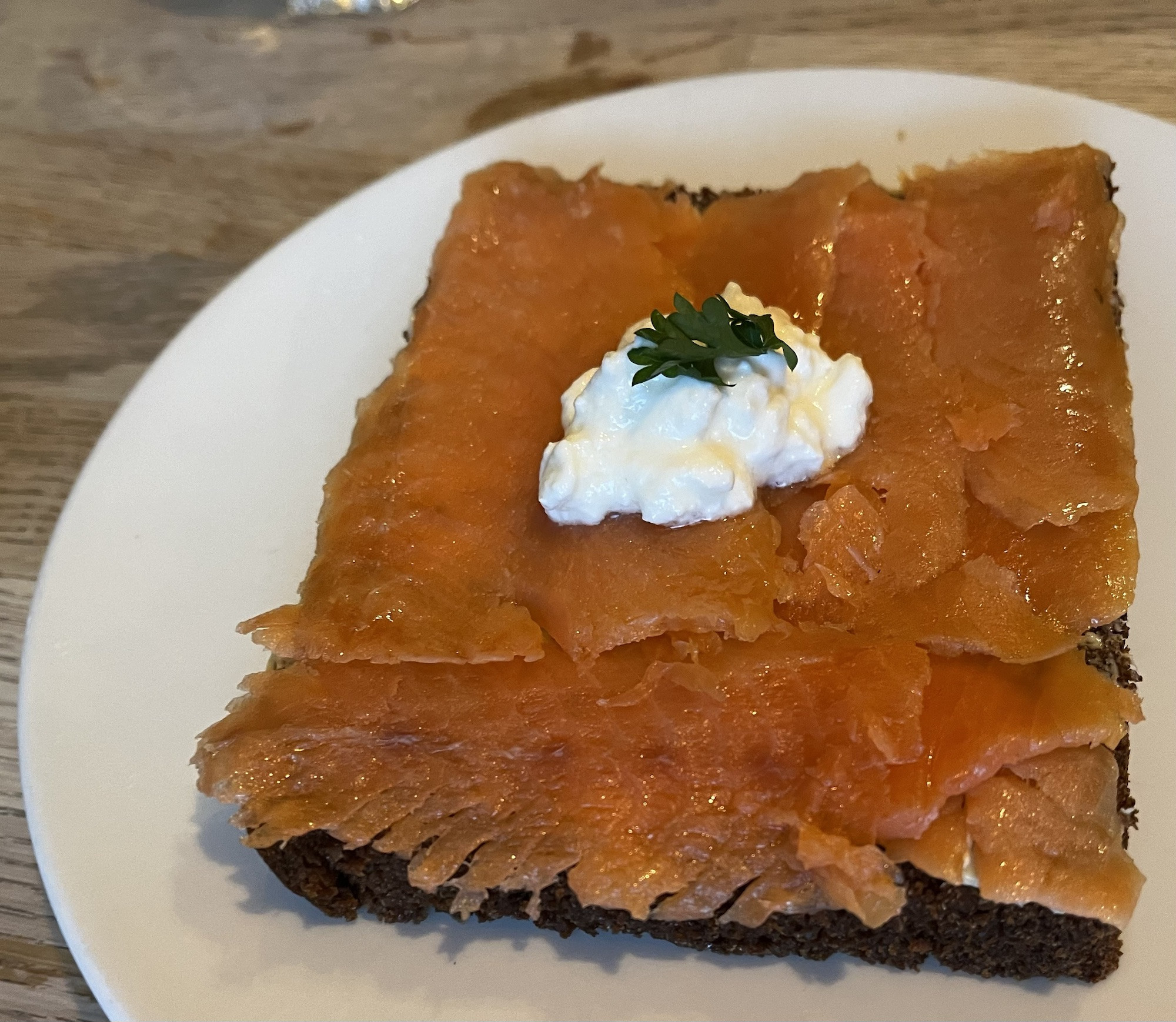 Homemade rye bread with cold-smoked trout, a flavorful and authentic Icelandic breakfast dish at Cafe Loki.