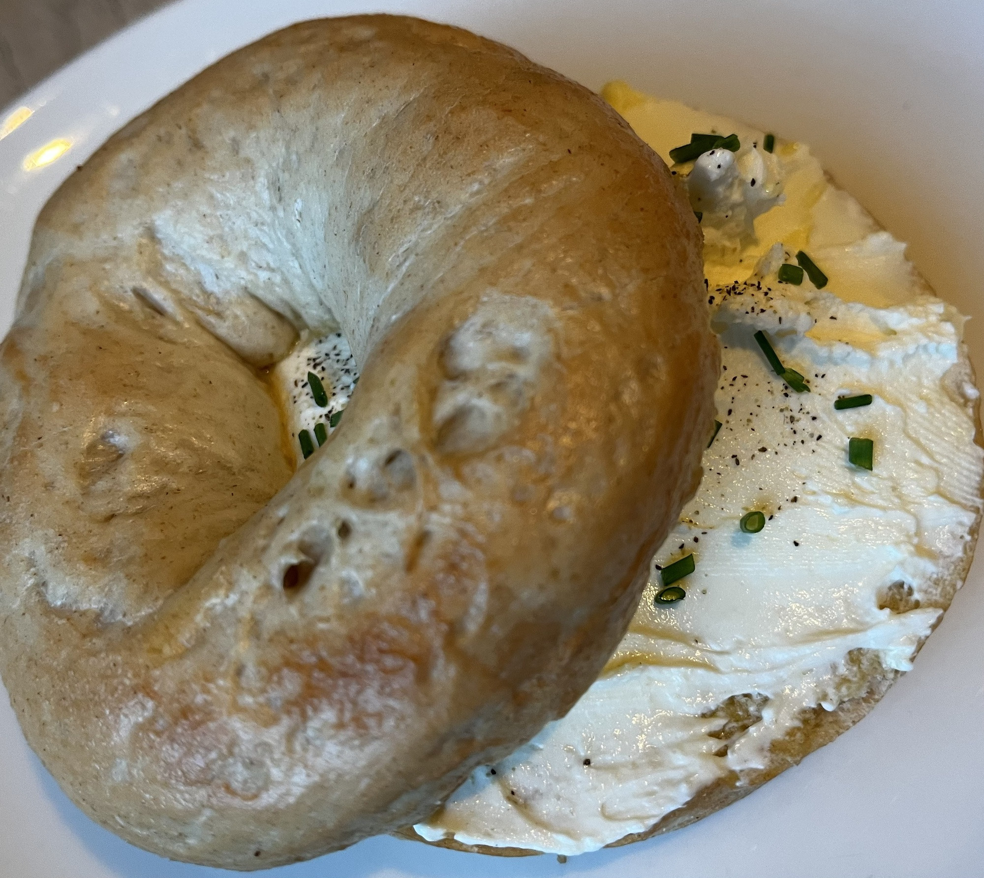 A bagel with cream cheese and chives, a lighter breakfast option at Cafe Loki in Reykjavik.
