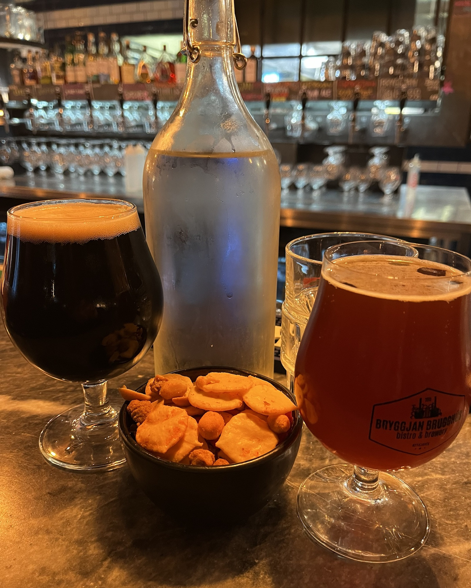 A close-up of a bowl of salty snacks, a perfect accompaniment to Icelandic beer at a Reykjavik brewery.
