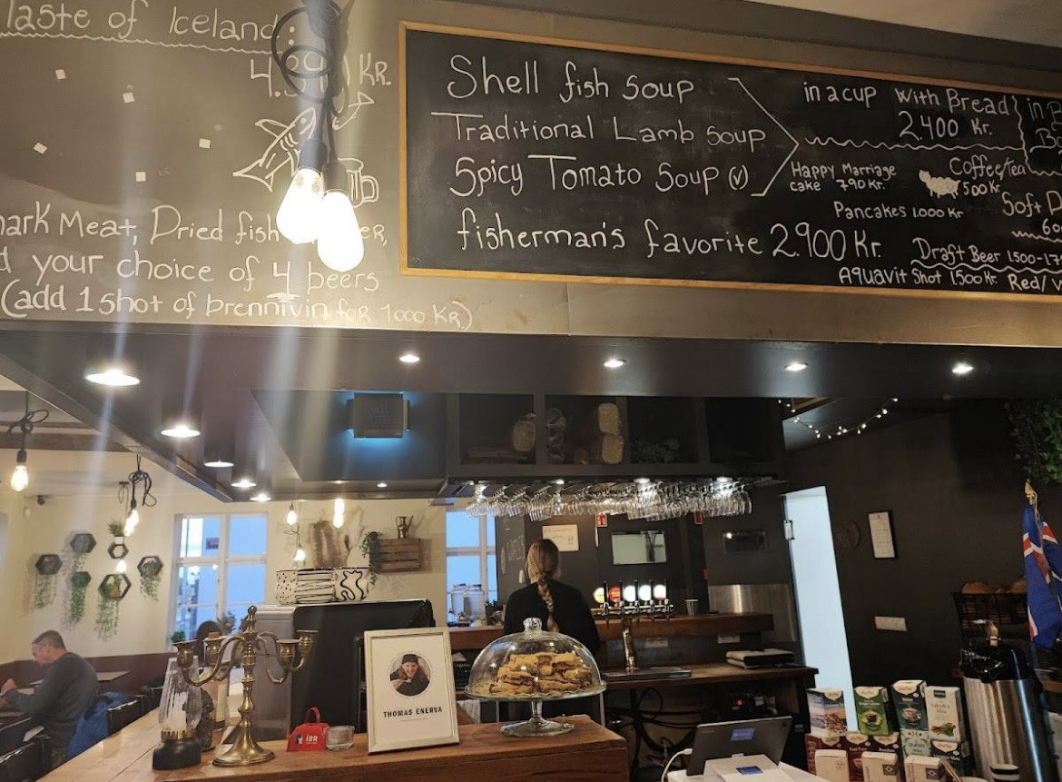 The counter area of Icelandic Street Food in Reykjavik, showing vats of soup and a casual dining atmosphere.