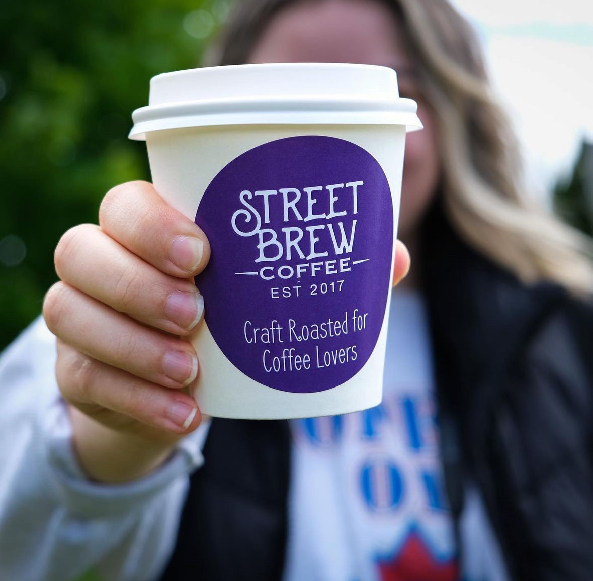 Close-up shot of Street Brew Coffee beans, highlighting their roasted texture and quality