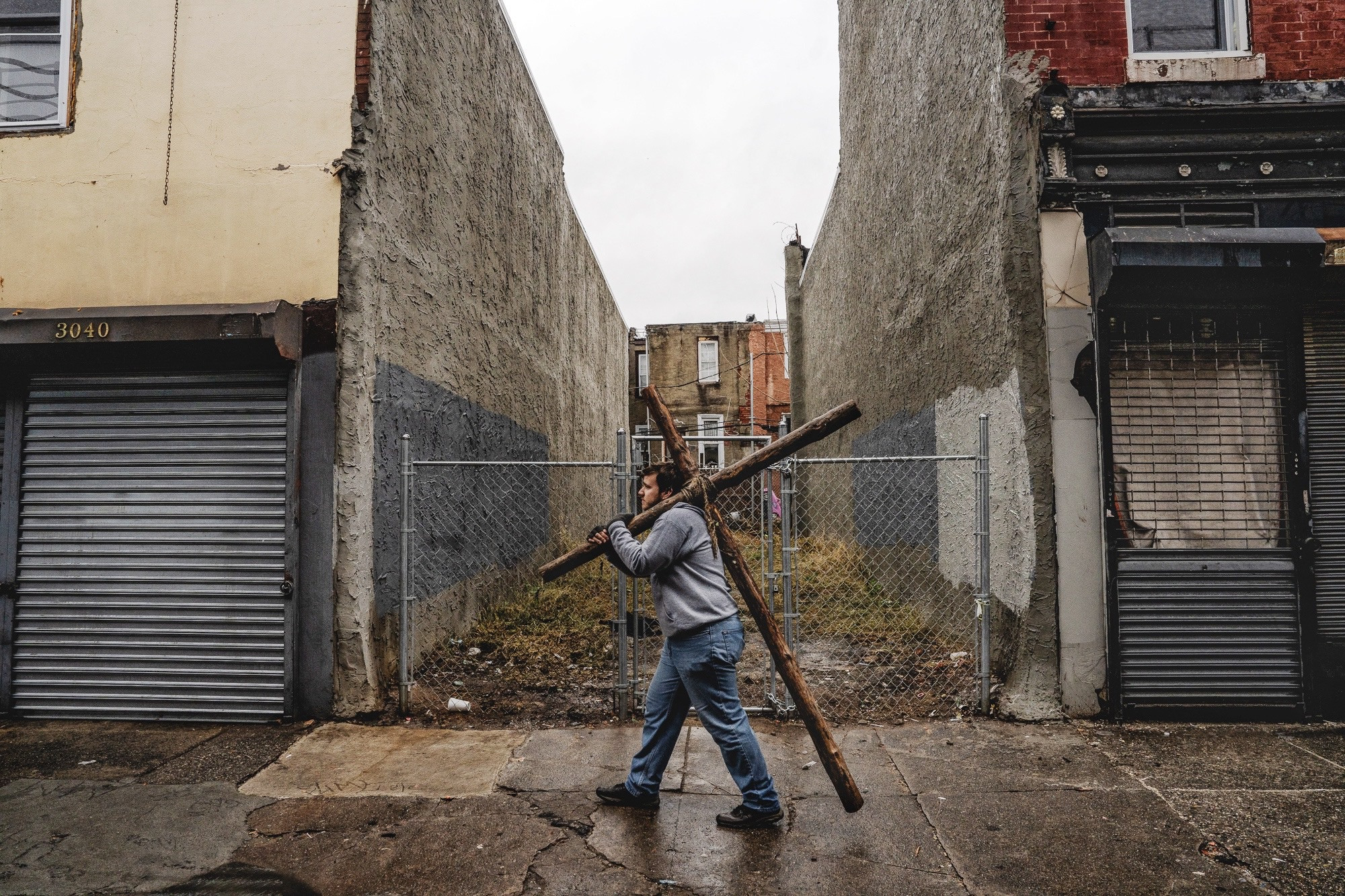 A moment of outreach and prayer on Kensington Avenue, Philadelphia, as individuals seek to connect with those in need of spiritual comfort.