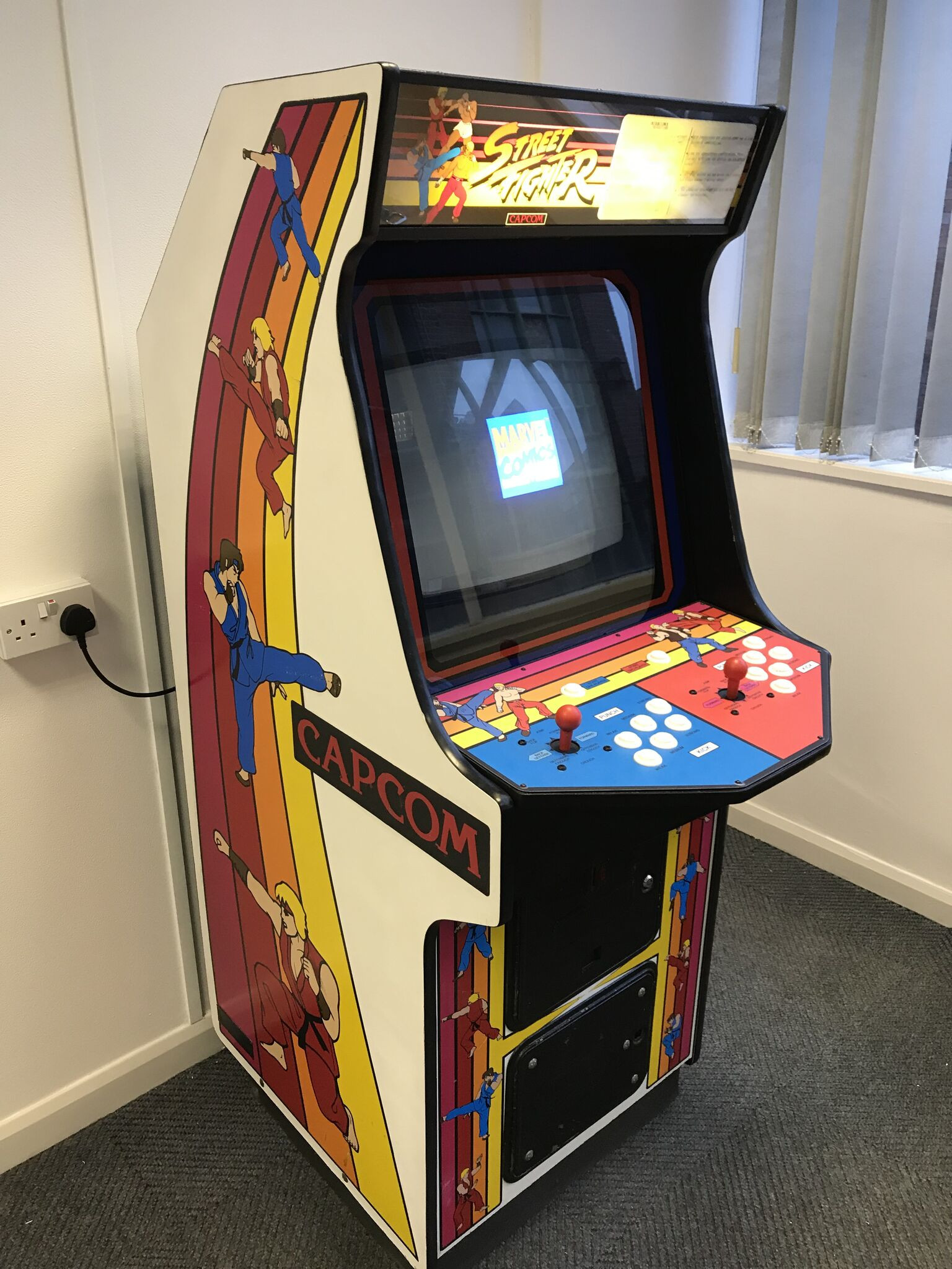 A European Street Fighter One cabinet distributed by Electrocoin, demonstrating regional variations in cabinet design.