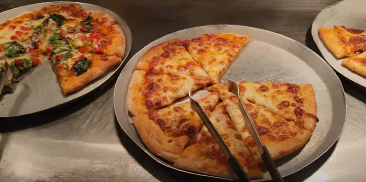 Various pizzas on display at the pizza station of Main Street Station Buffet
