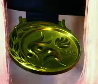Close-up of Manon's gold medal, showing Tokyo inscription and Earth design.