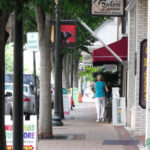 Brick-textured sidewalks, 19th-century style lampposts, benches, festive banners and mature trees add to the pedestrian experience of Middle Street.