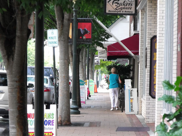 Brick-textured sidewalks, 19th-century style lampposts, benches, festive banners and mature trees add to the pedestrian experience of Middle Street.