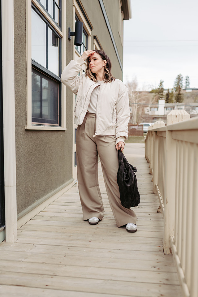Monochromatic taupe outfit details including Abercrombie Sloane trousers and Adidas Samba sneakers