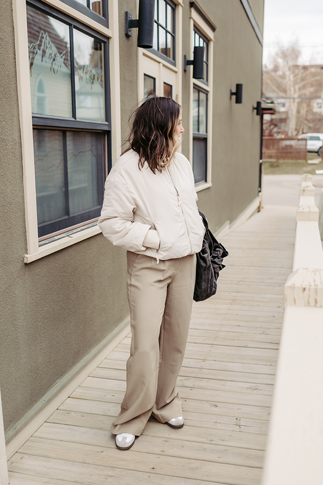 Profile view of a person in a monochromatic outfit showcasing Abercrombie trousers and tee