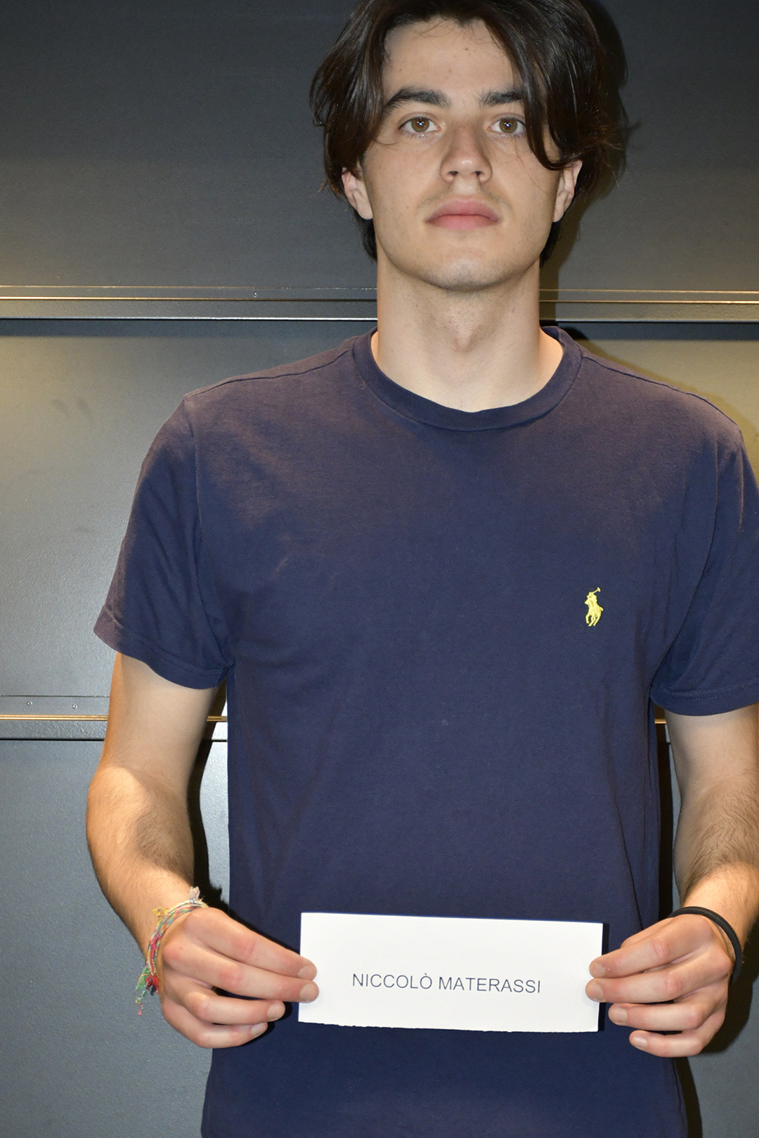 Niccolo Materassi posing for polaroids during the casting