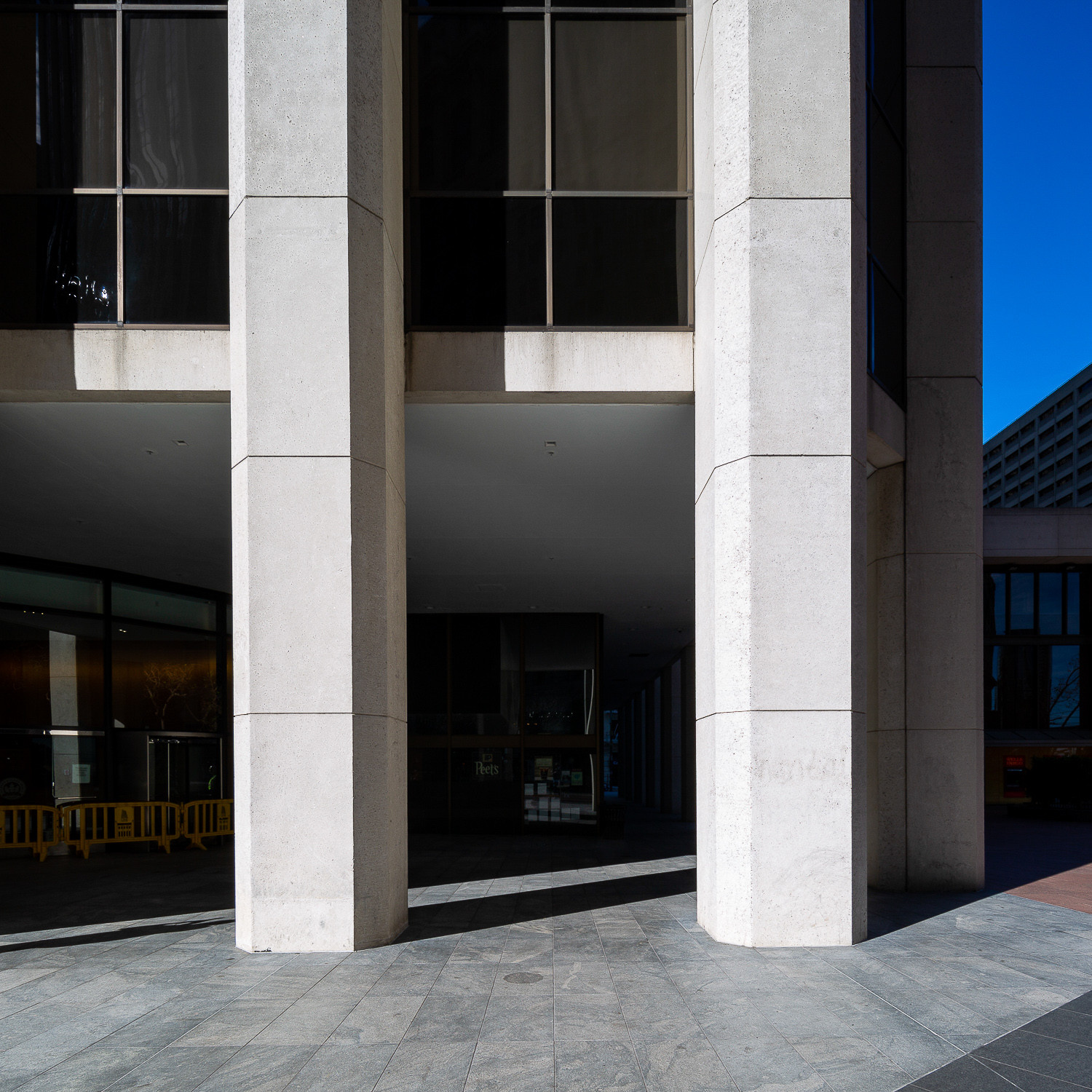 Close-up of the concrete pillars of One California Street, showcasing architectural details in San Francisco's Financial District
