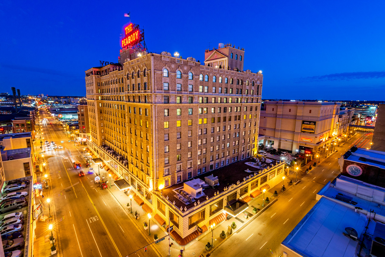 The Peabody Memphis illuminated at night, showcasing its grandeur and historic architecture near Beale Street.