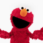 Elmo outreaching his hands.
