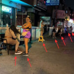 prostitutes line a street in Queens