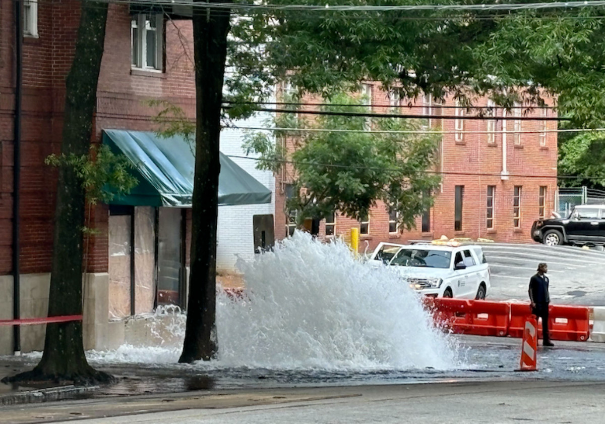 Broken windows of Eleventh Street Pub Atlanta, damaged by chunks of asphalt propelled by the force of a water main rupture.