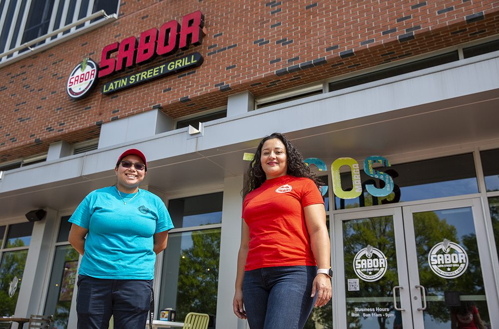 A vibrant hero shot of Sabor Latin Street Grill restaurant exterior, showcasing its inviting atmosphere and commitment to authentic Latin street food.