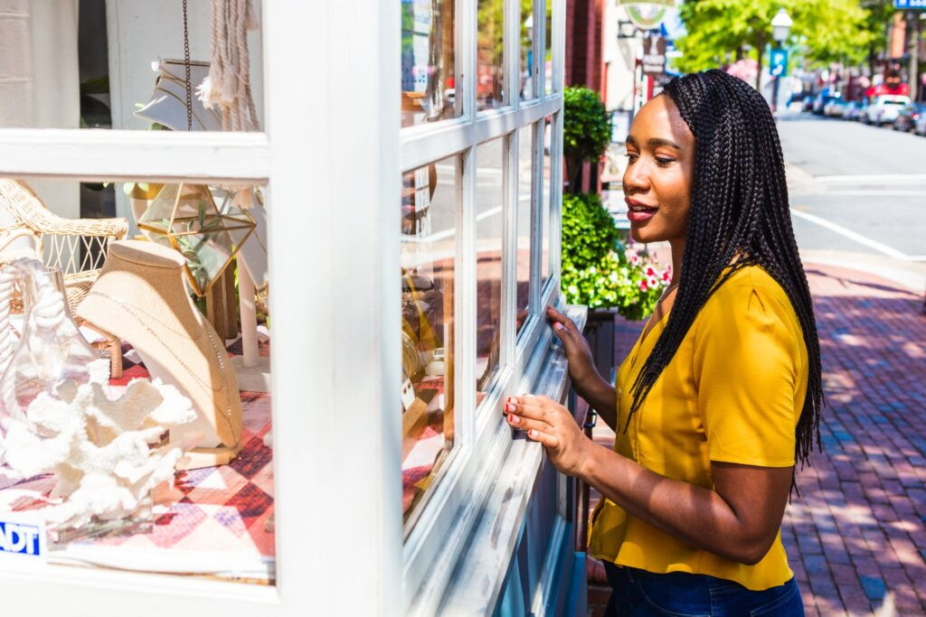 Elegant window display at She's Unique boutique, showcasing unique jewelry and gifts among the diverse king street stores of Alexandria.