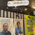 Vibrant interior of Third Street Stuff coffee shop in Lexington, KY, showcasing social justice-themed artwork by owner Pat Gerhard.