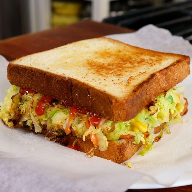 Delicious Korean street toast (Gilgeori Toast) on a plate, ready to eat.