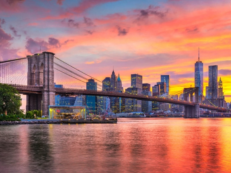Sunset over Pebble Beach Brooklyn, with Brooklyn Bridge and Lower Manhattan skyline in the background