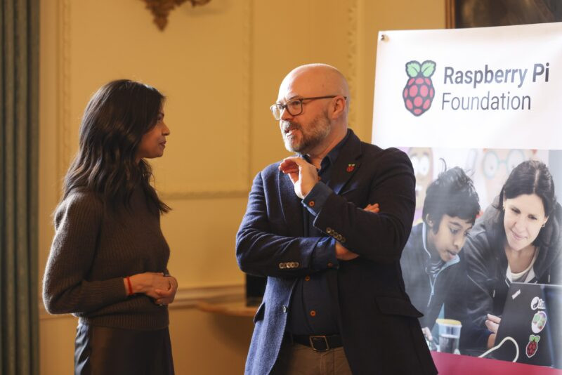 Akshata Murty, alongside Philip Colligan of Raspberry Pi Foundation, addresses students at a Code Club event in Number 10 Downing Street.