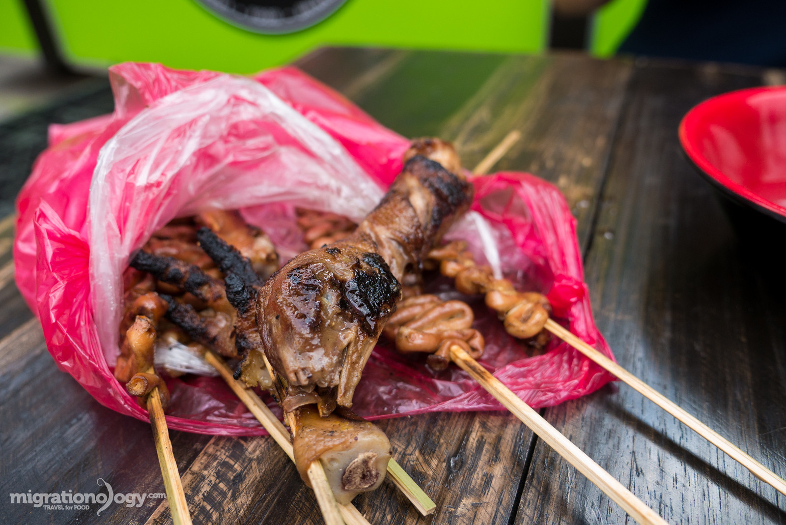 Grilled chicken heads and feet, known as Helmets and Adidas, common Filipino street foods.