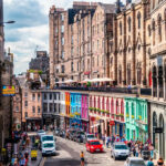 The iconic curve of Victoria Street in Edinburgh, showcasing its colourful buildings and charming atmosphere