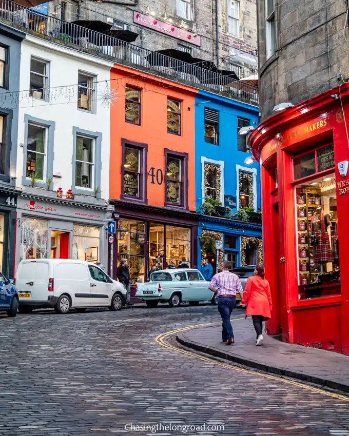 Victoria Street at dusk, showcasing its illuminated shopfronts and inviting ambiance in the evening